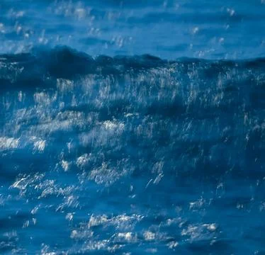 Waves with strong wind after a storm, abstract texture, Patagonia, Argentina. Stock Photos