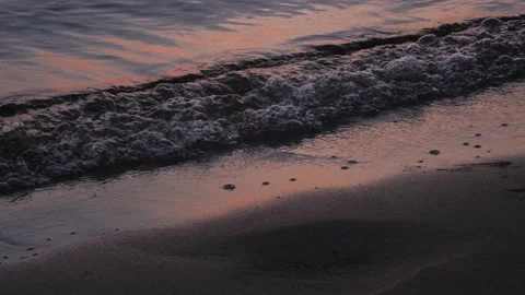 Waves on a summer evening at a pink sunset Video stock 204719793