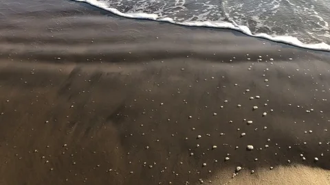 Waves at sunrise on a Cabo Frio beach Stock Footage 102472467