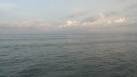 Waves At Sunset Against White Clouds Stock Footage 231742973