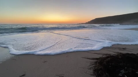 Waves on a sunset beach in Cornwall and seagulls Stock Footage 251306853
