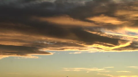 Waves at Sunset. Lenticular clouds at sunset Stock Footage 54728598