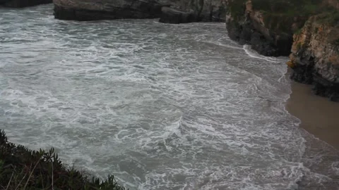 Waves at sunset in Os Castros beach, Ribadeo, Spain Stock Footage 303671093