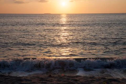 Waves at sunset Stock Photos