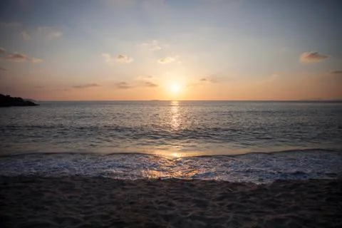 Waves at sunset Stock Photos