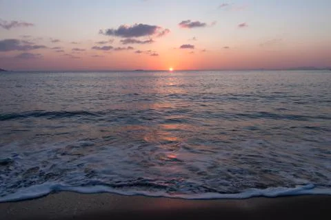 Waves at sunset Stock Photos