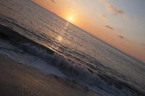 Waves at sunset Stock Photos