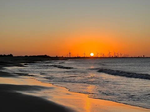 Waves at sunset Stock Photos