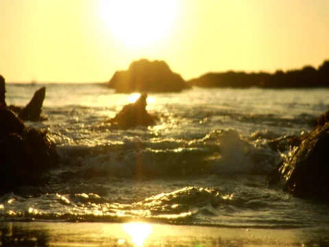 Waves on sunset rocks background Stock Footage 106275712