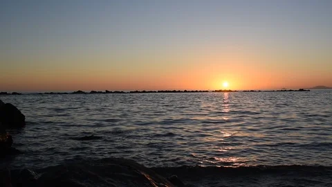 Waves at sunset with sound Stock Footage