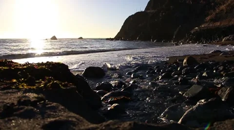 Waves in the Sunset - Trickling Stream Stock Footage 49782858
