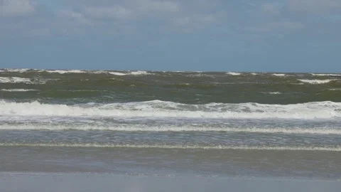 Waves, surf, man, beach, Wangerooge Island, East Frisian Island, East Frisia, Stock Footage 340927510