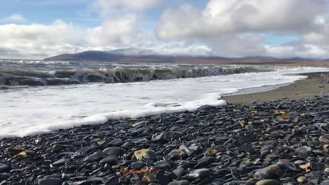 Waves of the surf. The mountains in the background. 스톡 동영상 80255176
