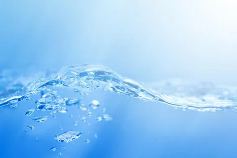 Waves on the surface of clear water such as in the sea or fish tank backgroun Stock Photos