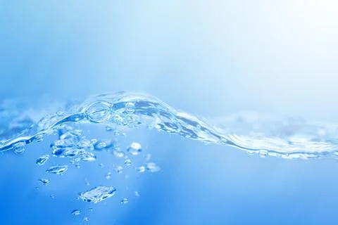 Waves on the surface of clear water such as in the sea or fish tank backgro.. Stock Photos