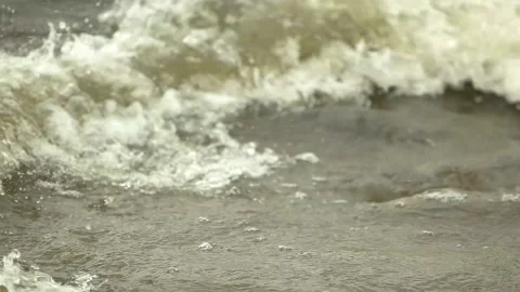 Waves on the surface of the dark green water in the river. Media. Natural Stockbeeldmateriaal 167370339