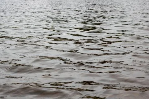Waves on the surface of the water close up Stock Photos