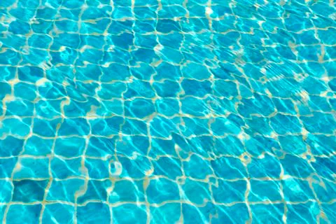 Waves on a surface of water in pool Stock Photos