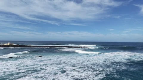 Waves surging over break water Tenerife Spain drone,aerial Vidéo 331150086