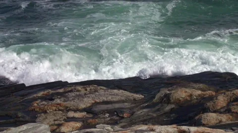 Waves surging onto the rocky coastline Stock Footage 34135739