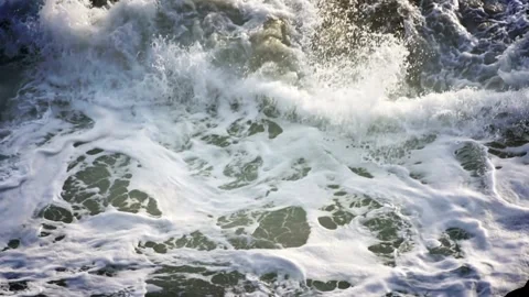 Waves swirling Cinema of close up ocean waves Atlantic beach shore background HD Video stock 336579823