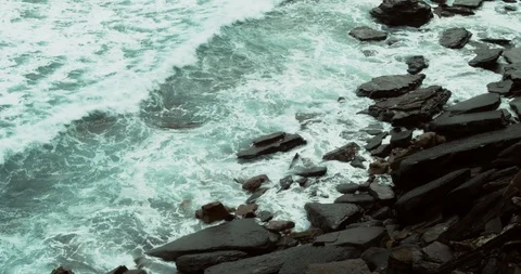 Waves Swirling On The Stones Stock Footage 125939243
