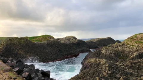 Waves through a Rocky Shore Stock Footage 101723529