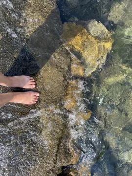 Waves Touching Feet Stock Photos