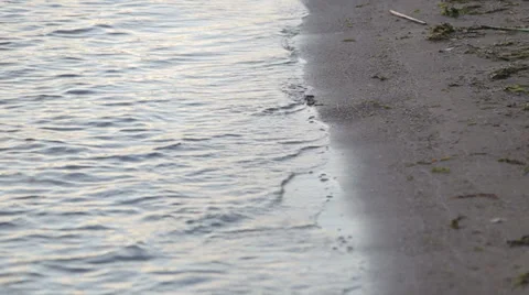 Waves touching lake shoreline Stock-Footage 27672524