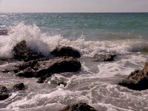 Waves touching the rocks Stock Photos