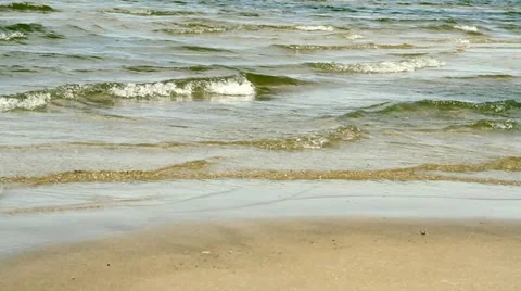 Waves touching sandy beach Stock Footage 11362883
