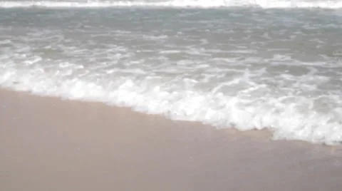 Waves touching sandy beach Stock Footage 50247158