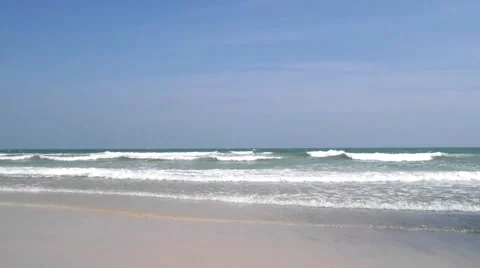 Waves touching sandy beach Stock Footage 50247271
