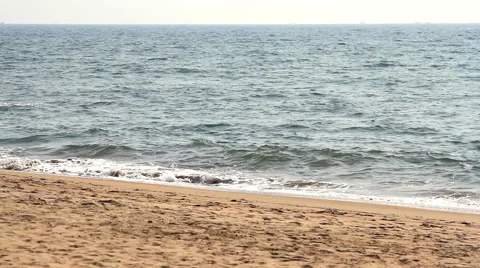Waves touching sandy beach Stock Footage 50681648