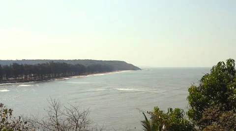 Waves touching sandy beach Stock Footage 50682033