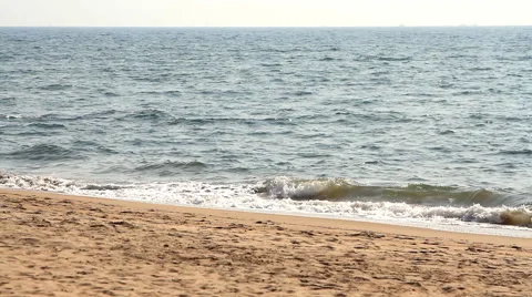 Waves touching sandy beach Stock Footage 51424609