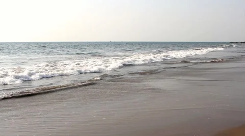 Waves touching sandy beach Stock Footage 51424649