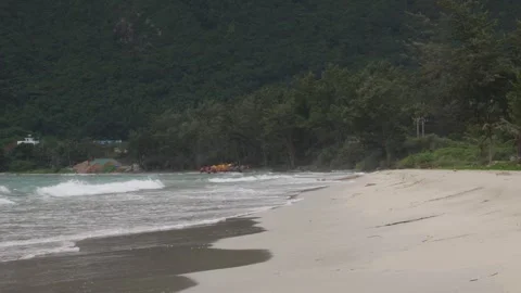 Waves Touching Sandy Beach, slow motion shot Stock Footage 242749882