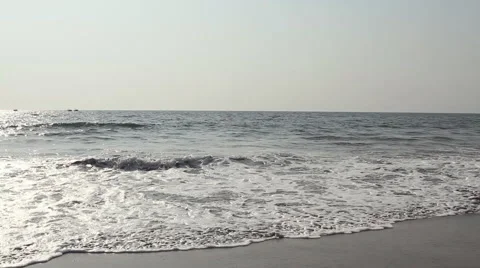 Waves touching sandy beach at sunny day Stock Footage 58279881