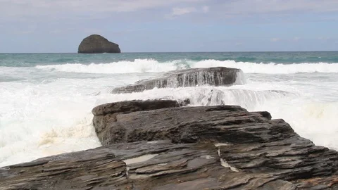 Waves at Trebarwith with Gull Rock Stock Footage