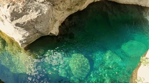 Waves on turquoise clear clean water surface Stock Footage 164584362