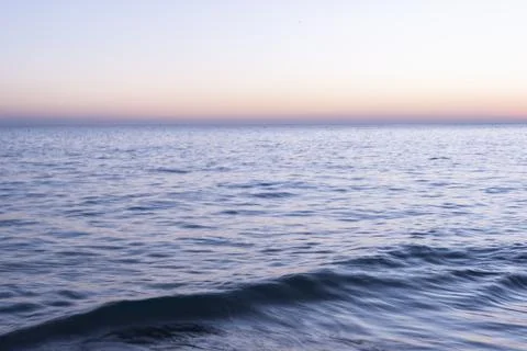 Waves at twilight Stock Photos