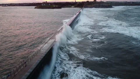Waves on tynemouth pier Stock Footage 197411097