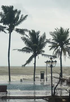 Waves from a typhoon splasing into a pool. Stock Photos