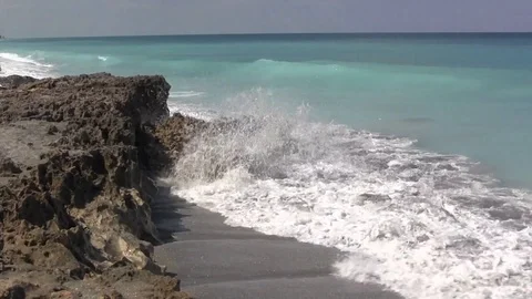 Waves vs Rocks Stock Footage 88972576
