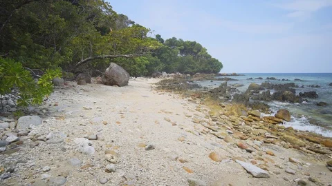 Waves wash and splash against rocks and boulders. Phuket, Thailand Stockbeeldmateriaal 97466912