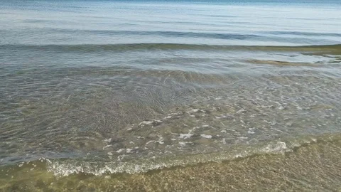 Waves wash the little shells on the sand Stock Footage 112753667