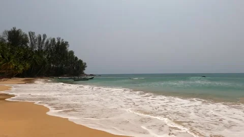 Waves wash over most of the sandy beach. Stock Footage 242166975