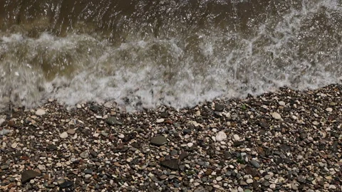 Waves Wash Over A Pebble Beach With Small Stones And Rocks. A Summer Day On The  Video stock 170506816