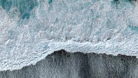 Waves wash over a reef from above Stock Footage 308722393